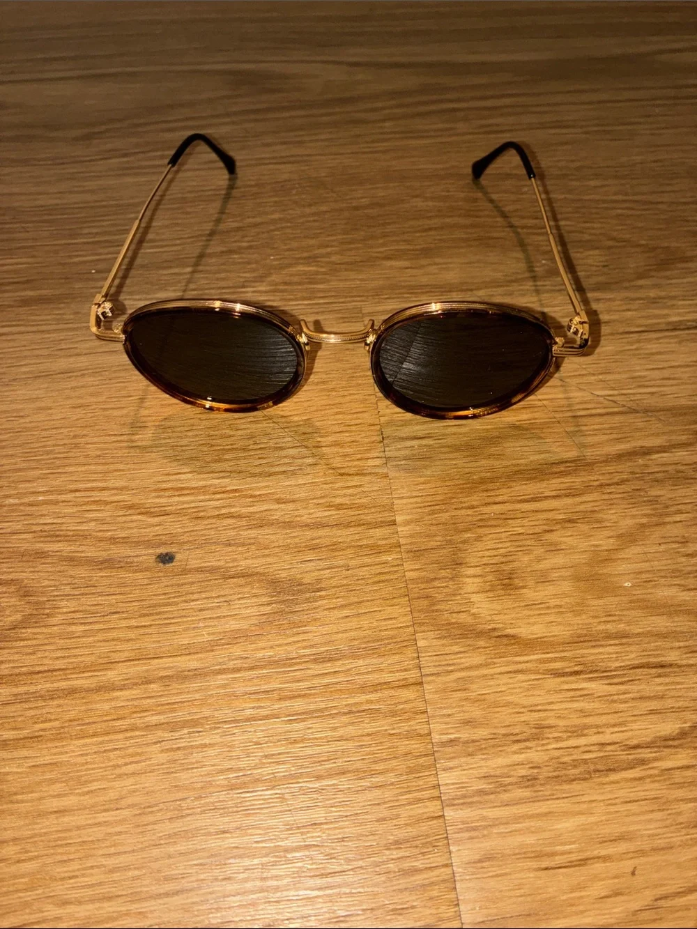 Oval Tortoiseshell Sunglasses with Gold Metal Arms